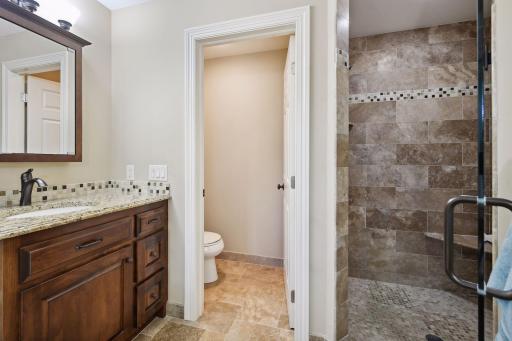 Separate vanity areas, large soaker tub, separate walk-in shower, and heated floors