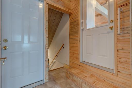 The entryway from the attached garage has double entry from garage and access to the basement