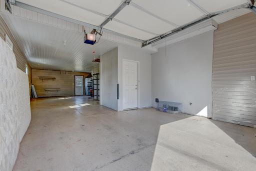 The attached tandem garage is perfect for additional parking, storage, or work space