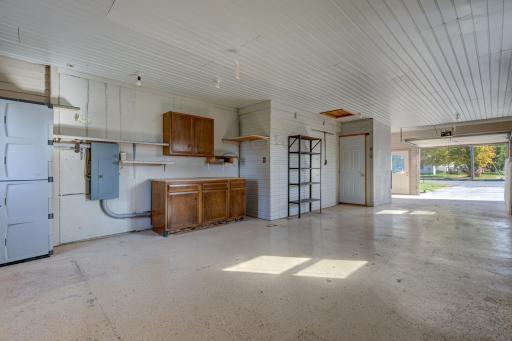 Double doors accessing the home and some cabinets for storage