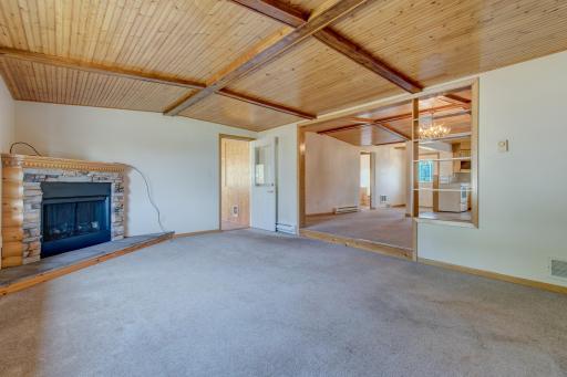 The stepdown living room is perfectly secluded while the large doorway still provides a sense of connection to the rest of the main floor