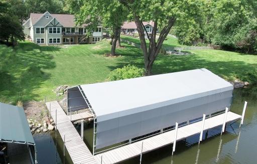 The new 40ft covered permanent dock stays with the home, and does not need to be taken out in the fall.