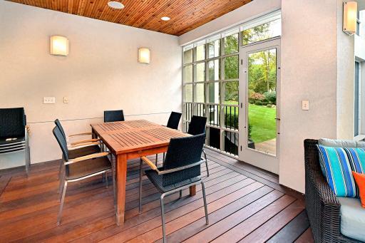 screened porch dining, deck with grill in background