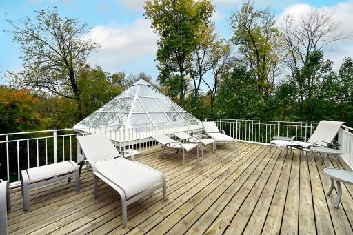 glass dome over the screened porch hot tub room, the upper corner bedroom/studio room has walkout to the deck