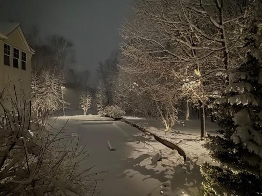 twilight pool area view from the primary bedroom suite