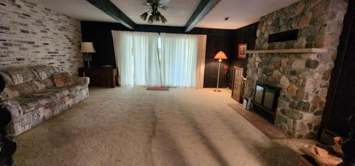 Living room with wood fireplace, to make things cozy on those cold winter nights.