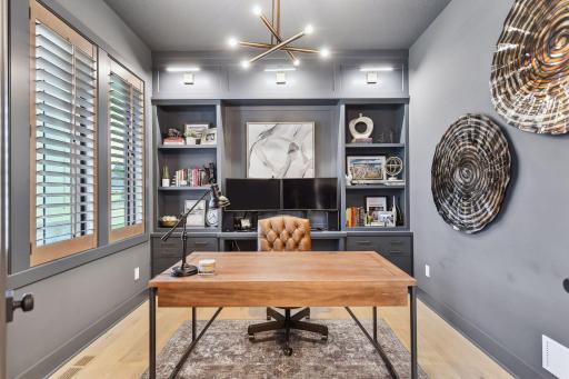 Main floor study with custom built in cabinetry