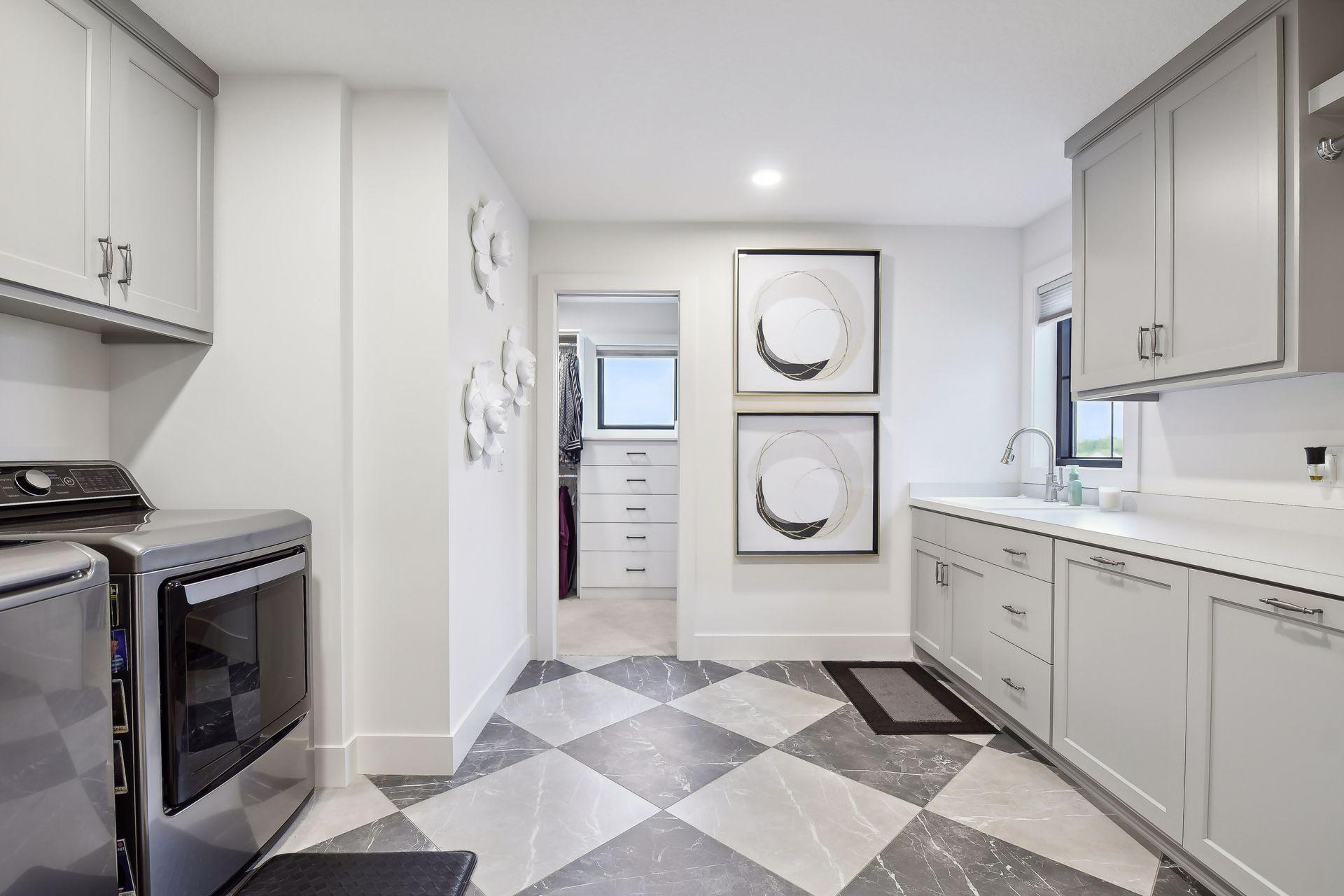 Upper level laundry off owners' closet and hall