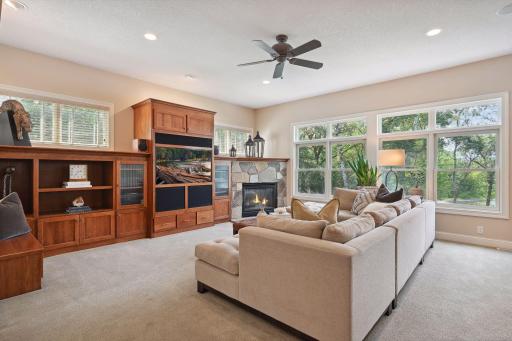 The main level features a true Great Room with wall-to-wall built-ins that include a gas fireplace and custom cherry cabinetry.
