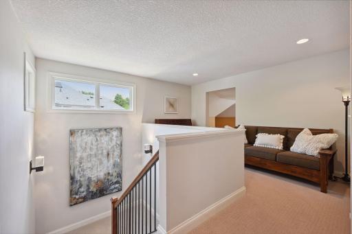 The home enjoys an abundance of natural light from the large windows throughout.