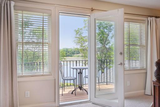 Enjoy a private Balcony that overlooks the backyard and lakeshore.
