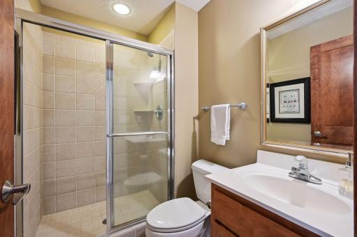 The 3/4 Bath has been finished with a tiled shower and comfort-height vanity.