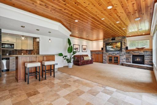 The lower level wet bar is equipped with a full size refrigerator, oven, dishwasher and microwave. Perfect for grabbing lunch or snacks while spending a day on the lake.