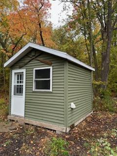 Cozy Bunkhouse offers comforts of two full-size built-in bunkbeds and heater.