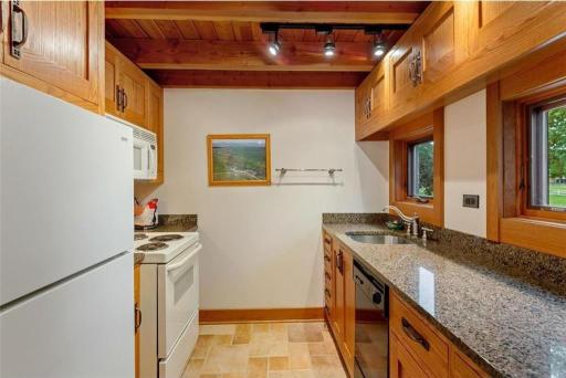 Plenty of cupboard and counterspace in this efficiency kitchen.