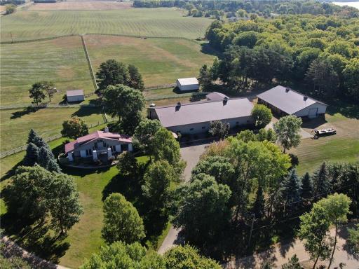 As you enter the property, you are immediately struck by the serene beauty of the landscape, which has been meticulously designed to cater to the equestrian enthusiast.