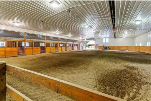 Well-maintained heated/lighted indoor arena with 9 box stalls w/automatic waterers, a tack room, wash bay, 2 tack up bays, vet room/laundry room and other storage.