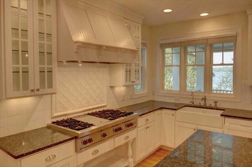 The farmhouse sink highlights this bright, light kitchen