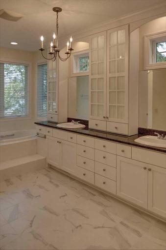 Master ensuite with double sinks and an abundance of cabinets