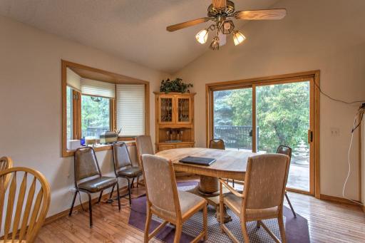 dining room with bow window and patio door