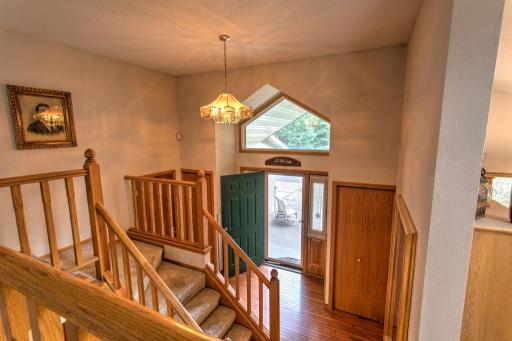 open entryway, wood floors