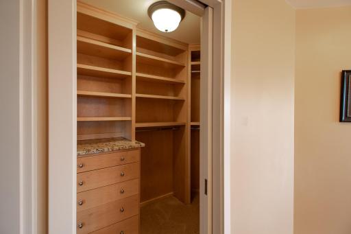 One of two walk-in custom closets in your Owners suite