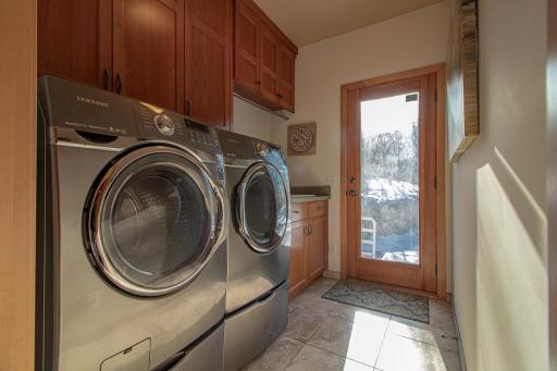 Main floor laundry with access to deck and patio