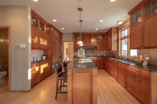 Cherry kitchen with center island and breakfast bar