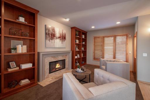 Come relax by the wood fireplace in your sitting room/library