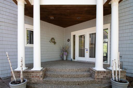 Welcoming front entrance with aggregate patio