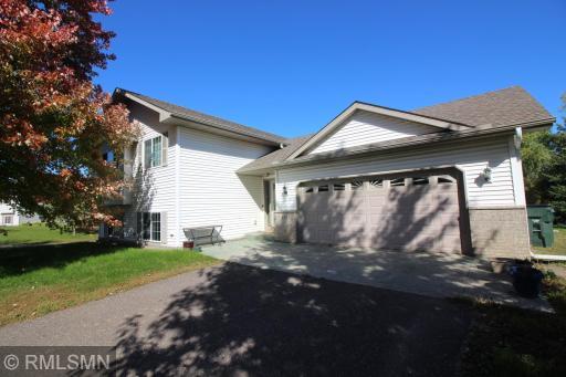 The attached garage is heated, insulated and sheet rocked and has water running into it. The cabinets in the garage will stay so your little work area is ready for action.