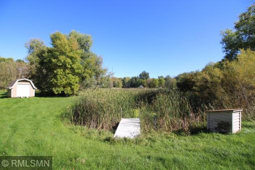 Here is your private watering hole. Seller has a added a pump house and pump for watering the yard. Dock is not included.
