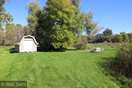 The huge city lot offers an opportunity to create a beautiful outdoor living space. Bring your landscaping vision and design something to escape to spring through fall. Your own little secluded sanctuary right in town. Shed is included with the sale
