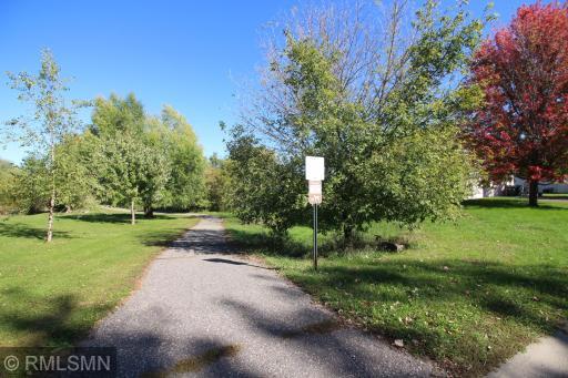 The walking path is located on the edge of the property that connects to a trail system of walking paths that runs throughout the city on Annandale.