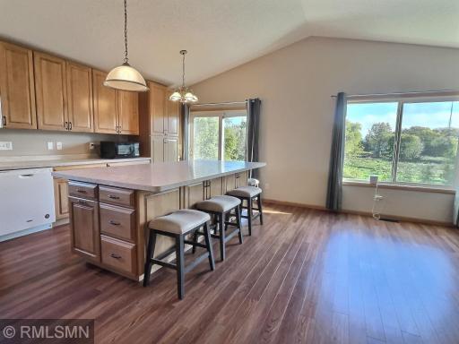 The upgraded kitchen now showcases a large center island along with a ton of new cabinets. Check that view out makes you feel like your living in the country.