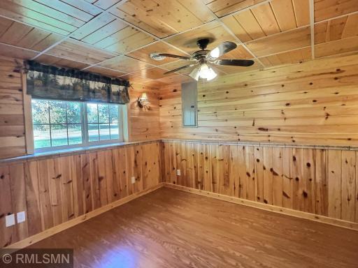 The primary bedroom is located in the lower level of the home with walk in closet and private full bath.