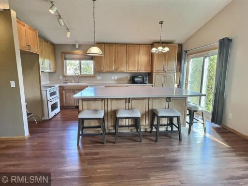 The kitchen had a makeover and seller designed a multipurpose center island. Used as your dining area and work station for the chef of the house. Ample cabinet space under the island along with the additional cabinets that were added to the kitchen.
