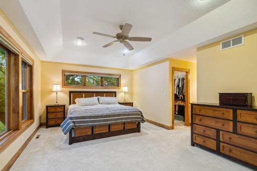 Primary bedroom with double closet , transom window above the bed...