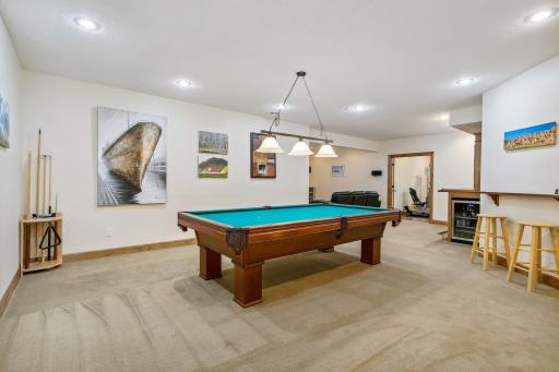 Billiard with view towards Amusement room and Exercise room
