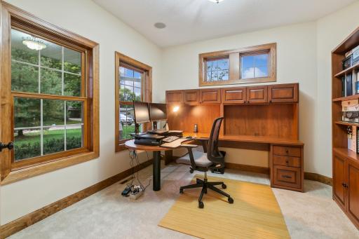 on the opposite side of the Foyer is the main floor Office with double french door entry. 2 large windows overlooking the neighborhood plus transom windows for lots of natural light.