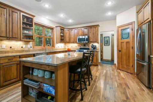 view of kitchen towards back hall with 1/2 guest bath, enclosed closet and storage space
