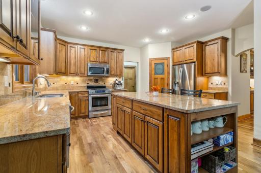 oodles of cabinets, counter space and two separate areas for display or cookbooks