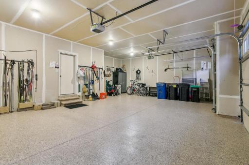 Oversized 3 car garage with plenty of storage opportunities and EXPOXY floor.