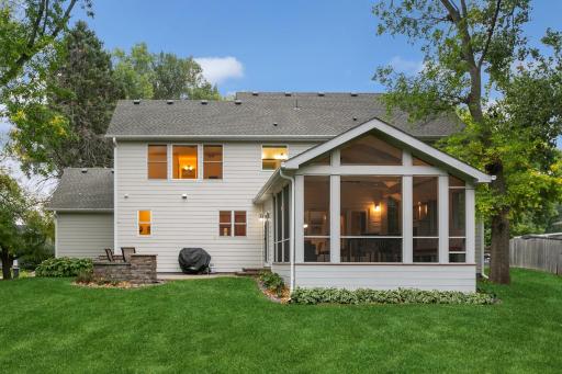 Straight on view of Sun room and paver patio