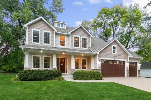 Enjoy greeting your neighbors from the front porch. Irrigation system for entire yard plus Invisible fence with one collar will stay!