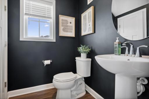 Conveniently located main level half bath just steps from the front door and garage. *Photos are of another home, some features and colors may vary.