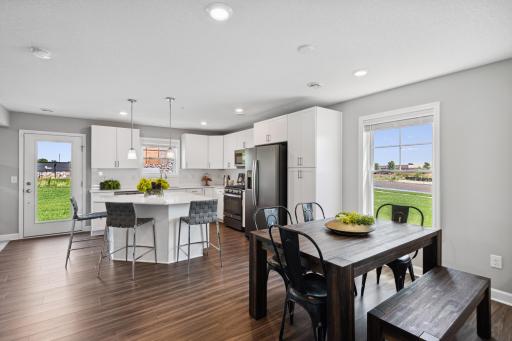 Soaked in natural sunlight, the homes eat-in dining room has ample space for a dining table in the heart of the home. *Photos are of another home, some features and colors may vary.