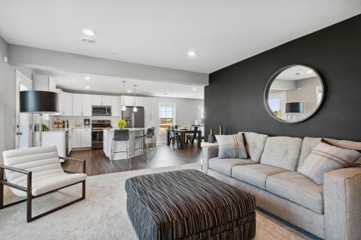 This spacious and open family room seamlessly connects to the kitchen. *Photos are of another home, some features and colors may vary.