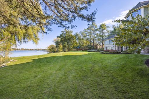 This lakeside lawn is ready for many wonderful memories, fall football, croquet, soccer or volleyball with a gorgeous backdrop of turtle Lake.