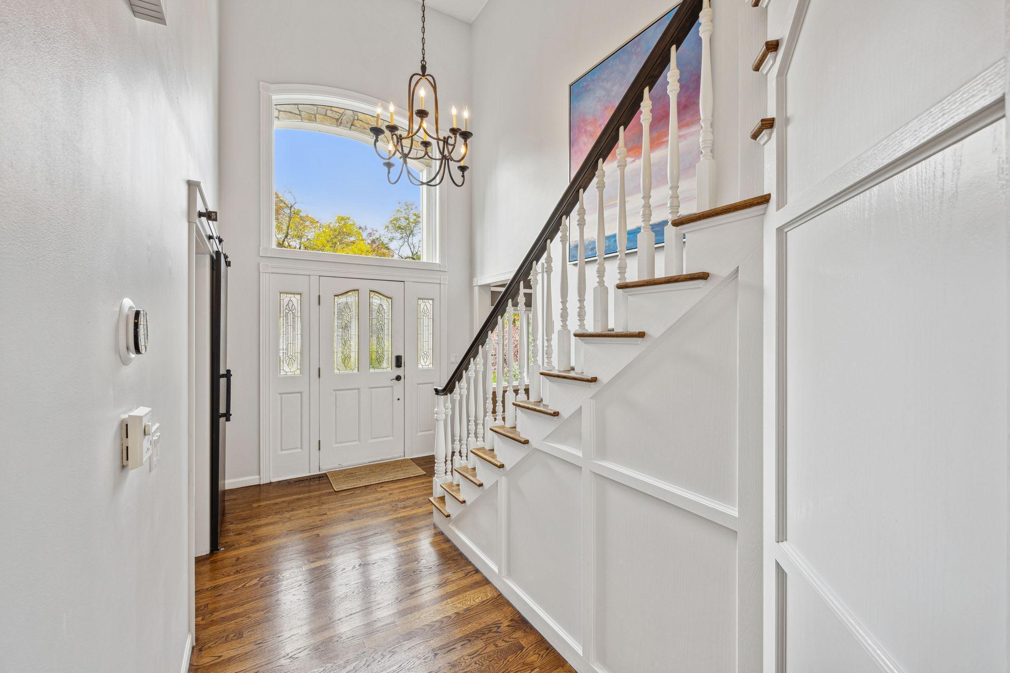 Great light in the foyer with large window above entry door.